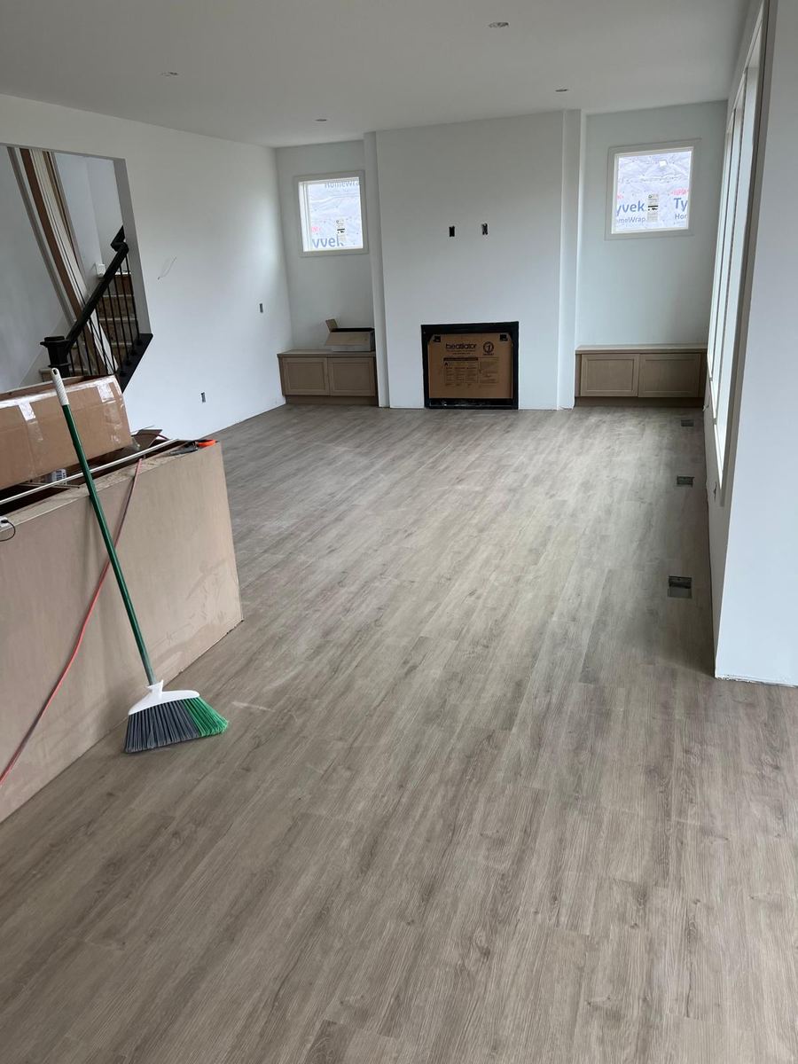 After — finished greige LVP family room