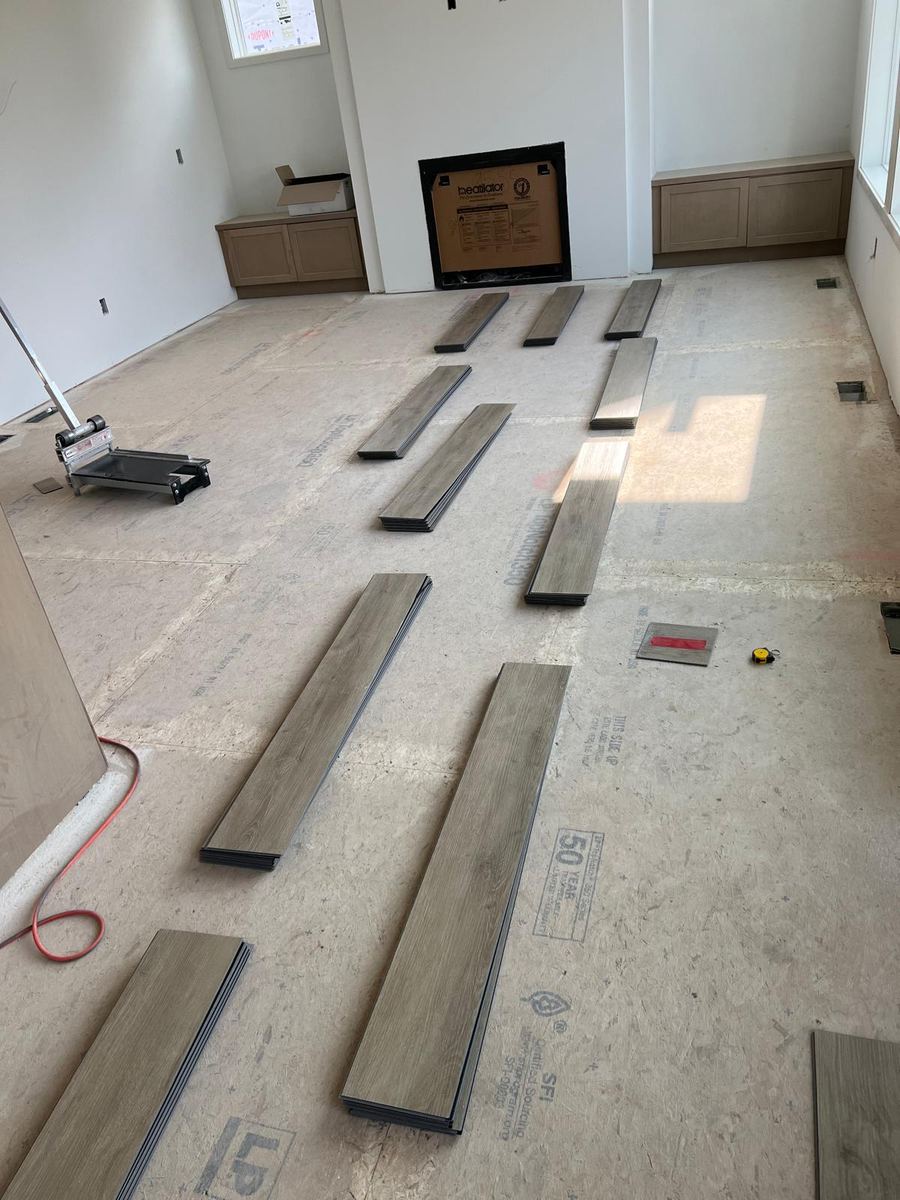 Before — LVP planks laid out on subfloor