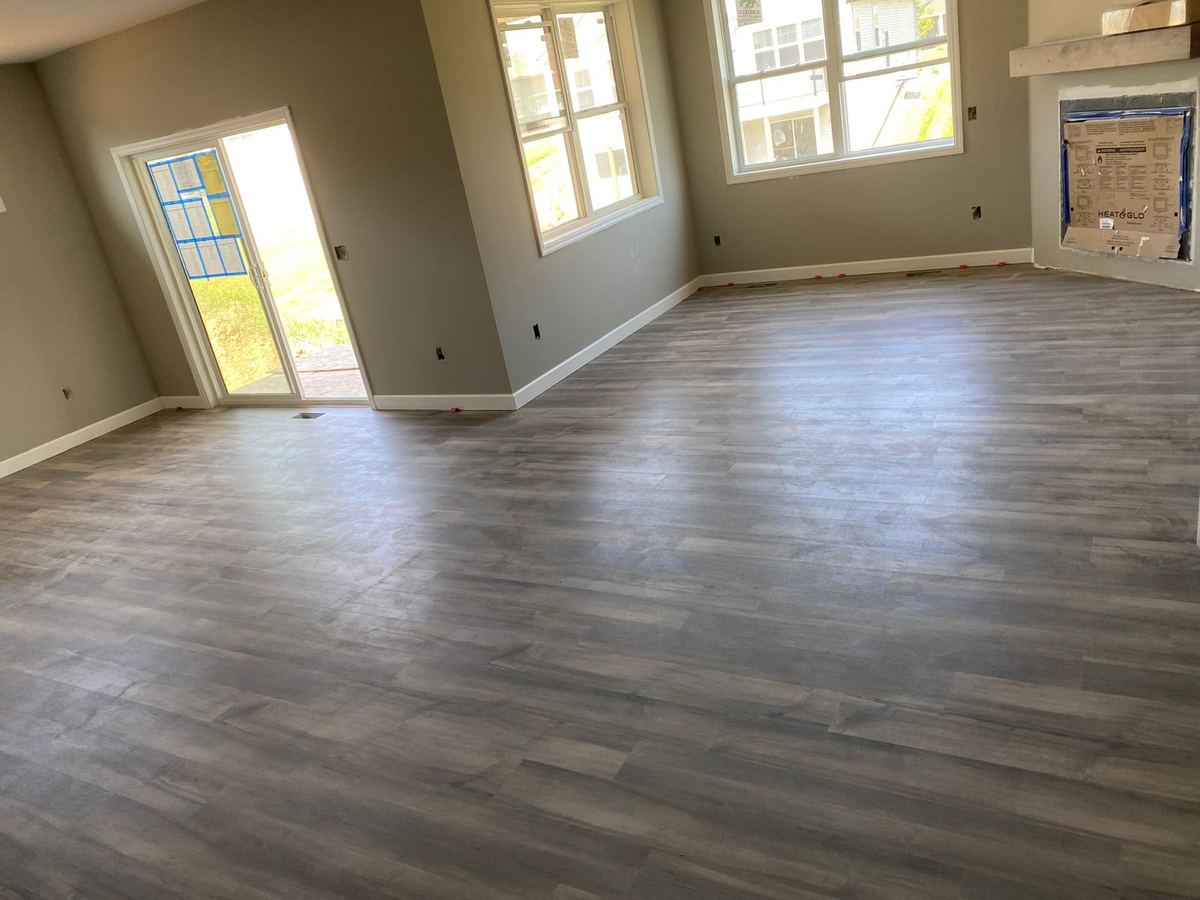 After — gray maple LVP great room