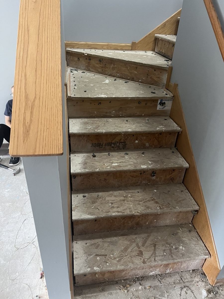 Before — bare plywood winder stairs
