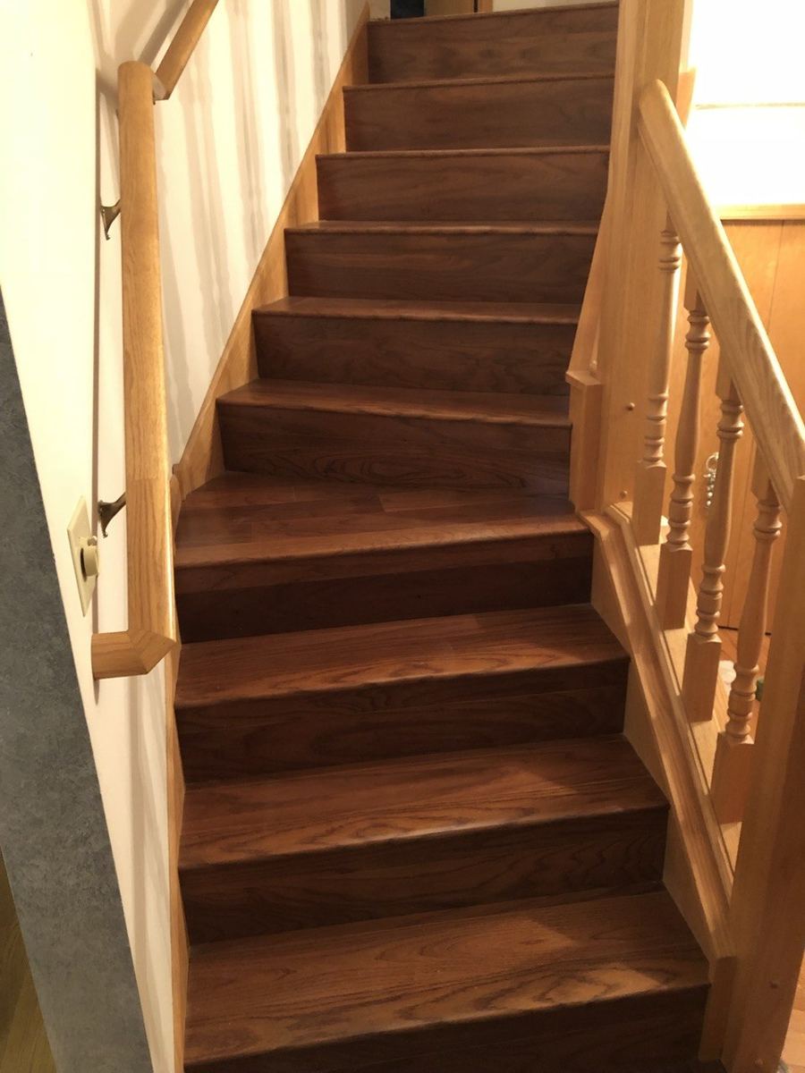 After — walnut-stained oak staircase