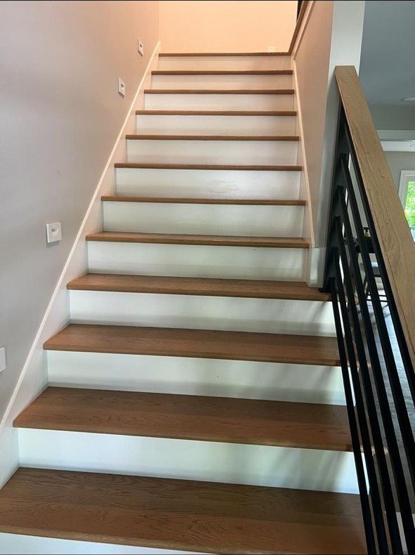 Oak treads with black metal railing