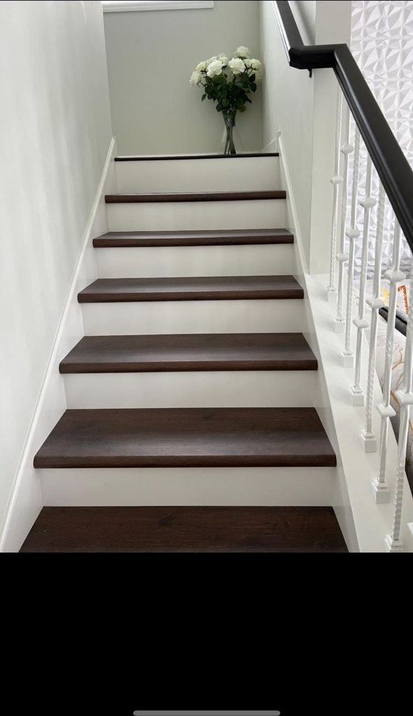 Dark stair treads with white balusters