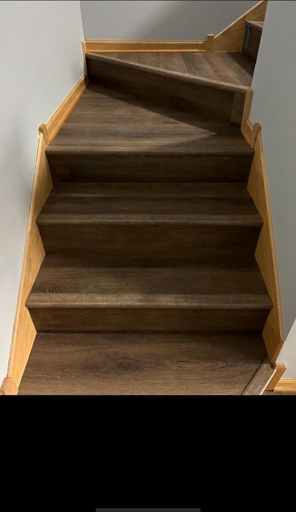 Dark LVP winder staircase